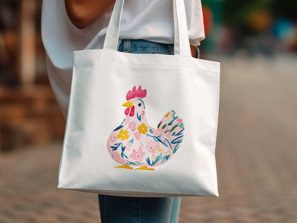 White tote bag with a colorful floral chicken illustration.