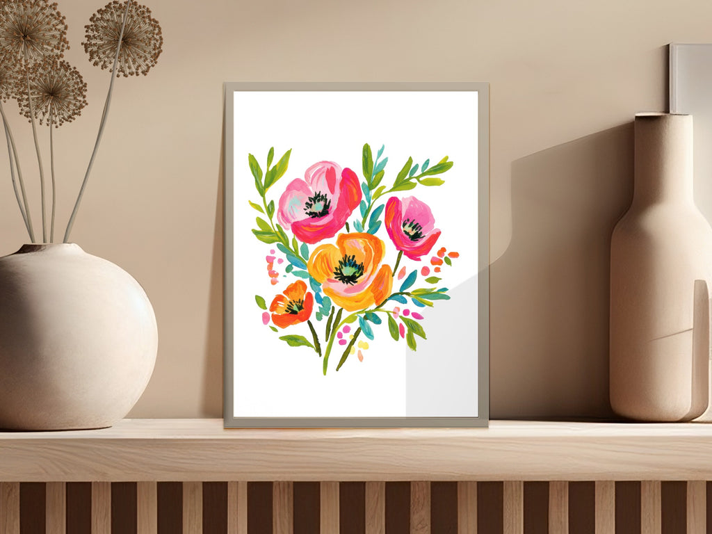 Colorful watercolor floral painting of poppies and other flowers in a framed art print.