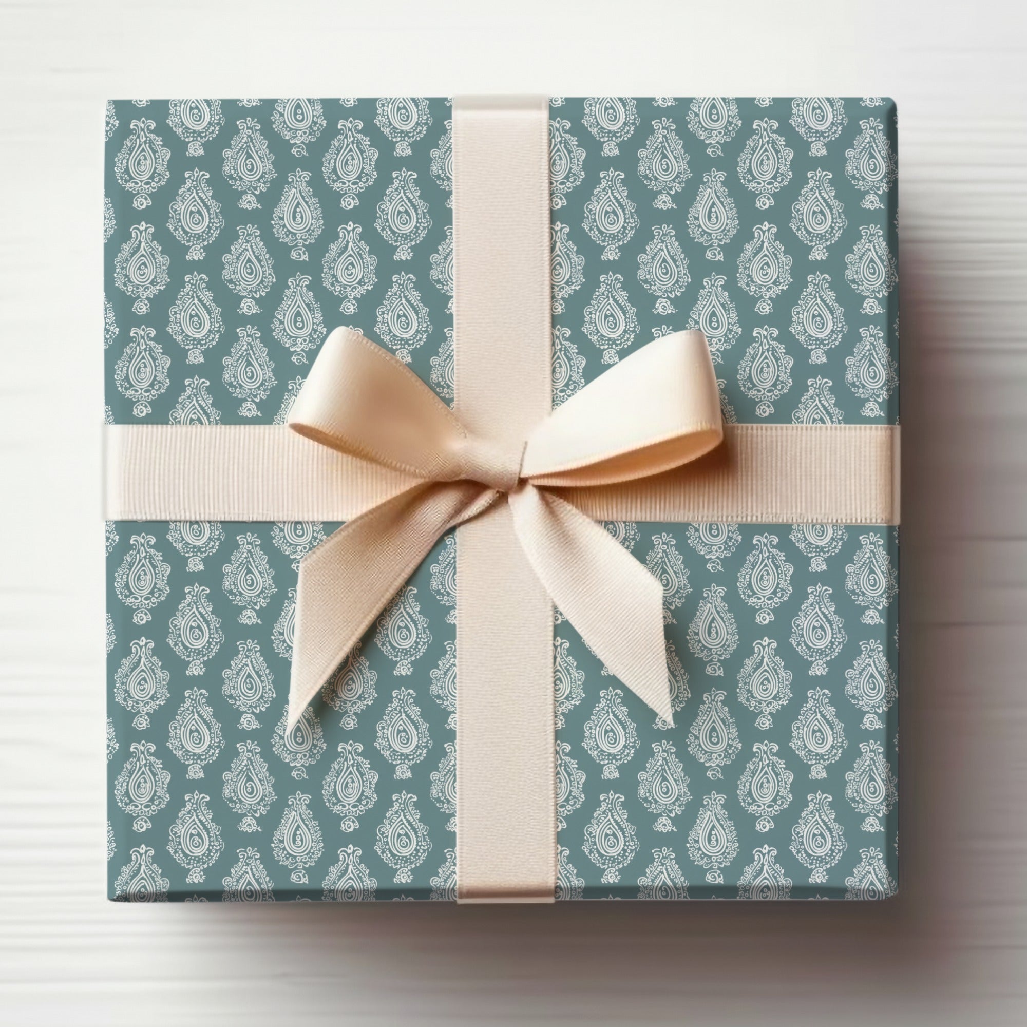 Elegant Patterned Gift Wrapping with Cream Bow Box