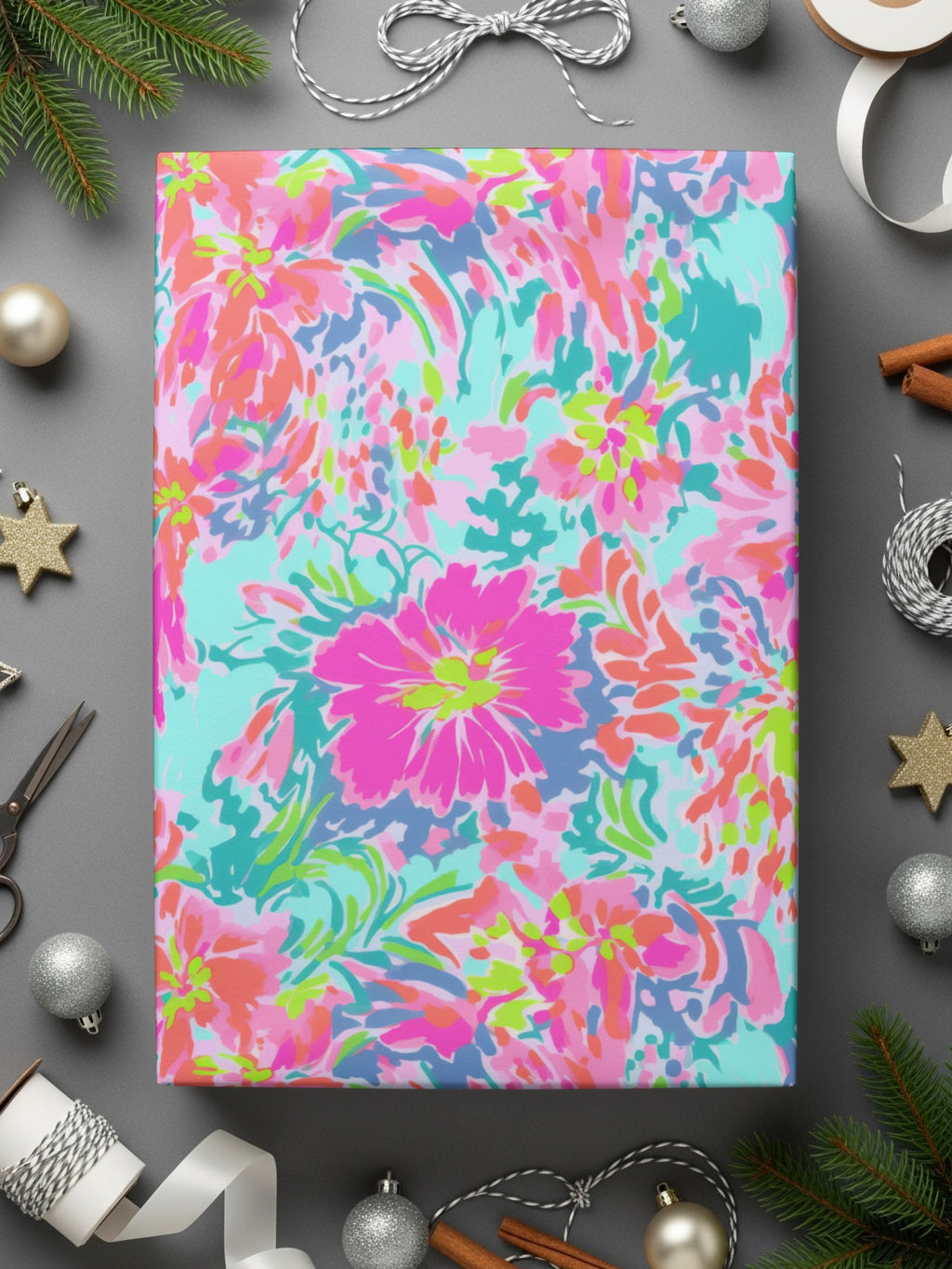 Rolled wrapping paper with a bright pink and blue floral pattern.