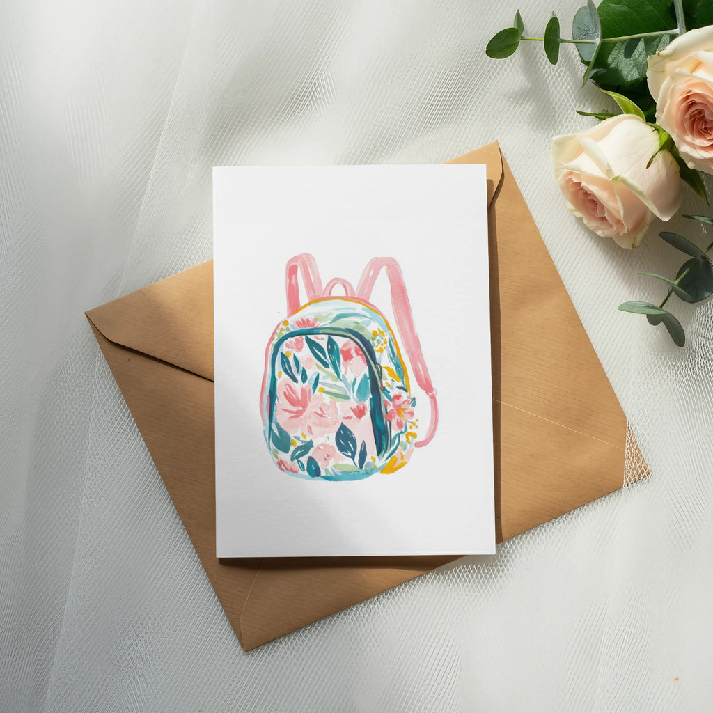Watercolor floral backpack illustration on an open envelope with roses.
