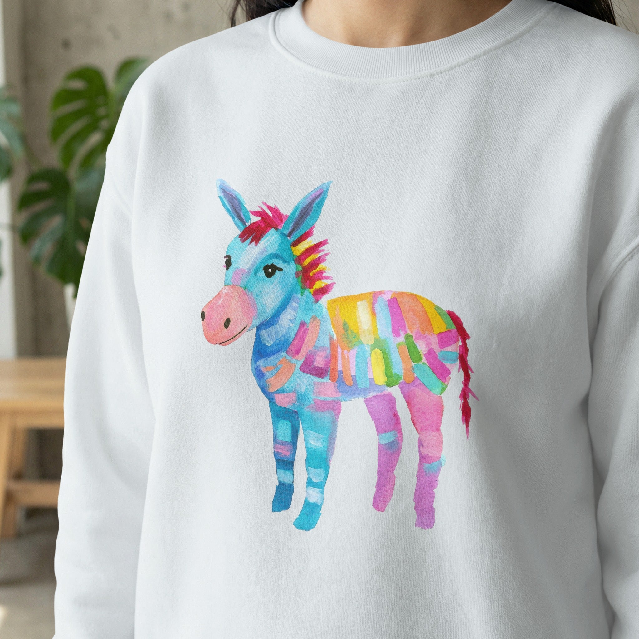 White sweatshirt with a colorful watercolor donkey print.