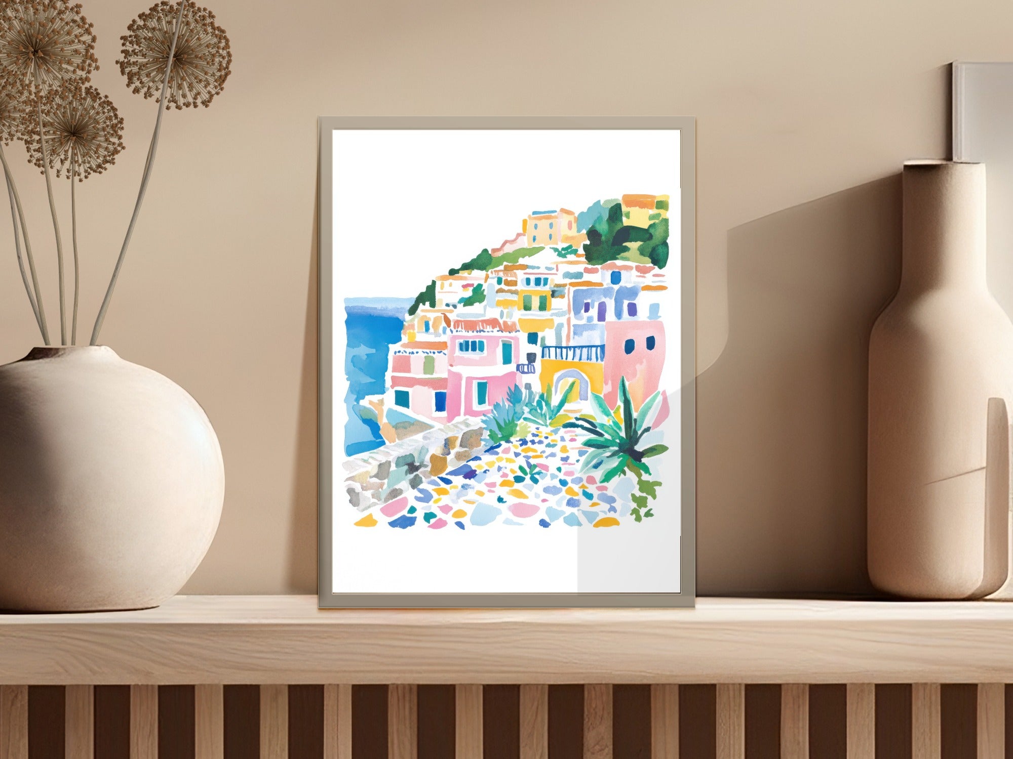 Watercolor painting of colorful buildings on a hillside overlooking the sea.