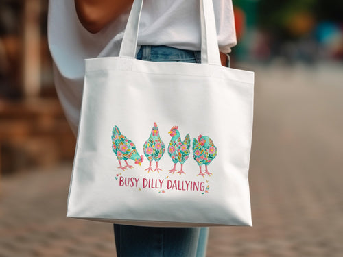 White tote bag with colorful floral chickens and "Busy Dilly Dallying" text.