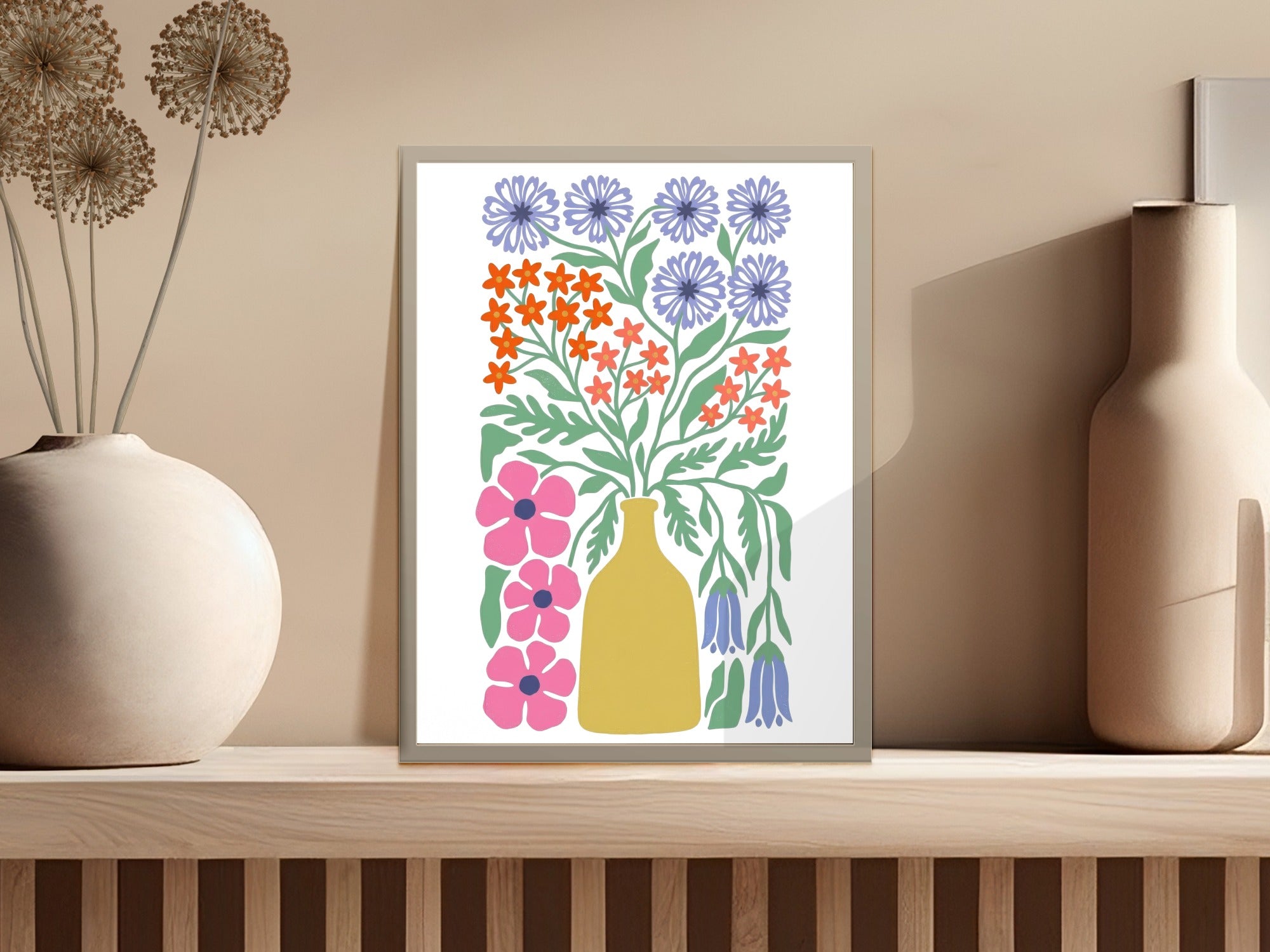 Abstract floral bouquet in yellow vase, framed on a shelf.