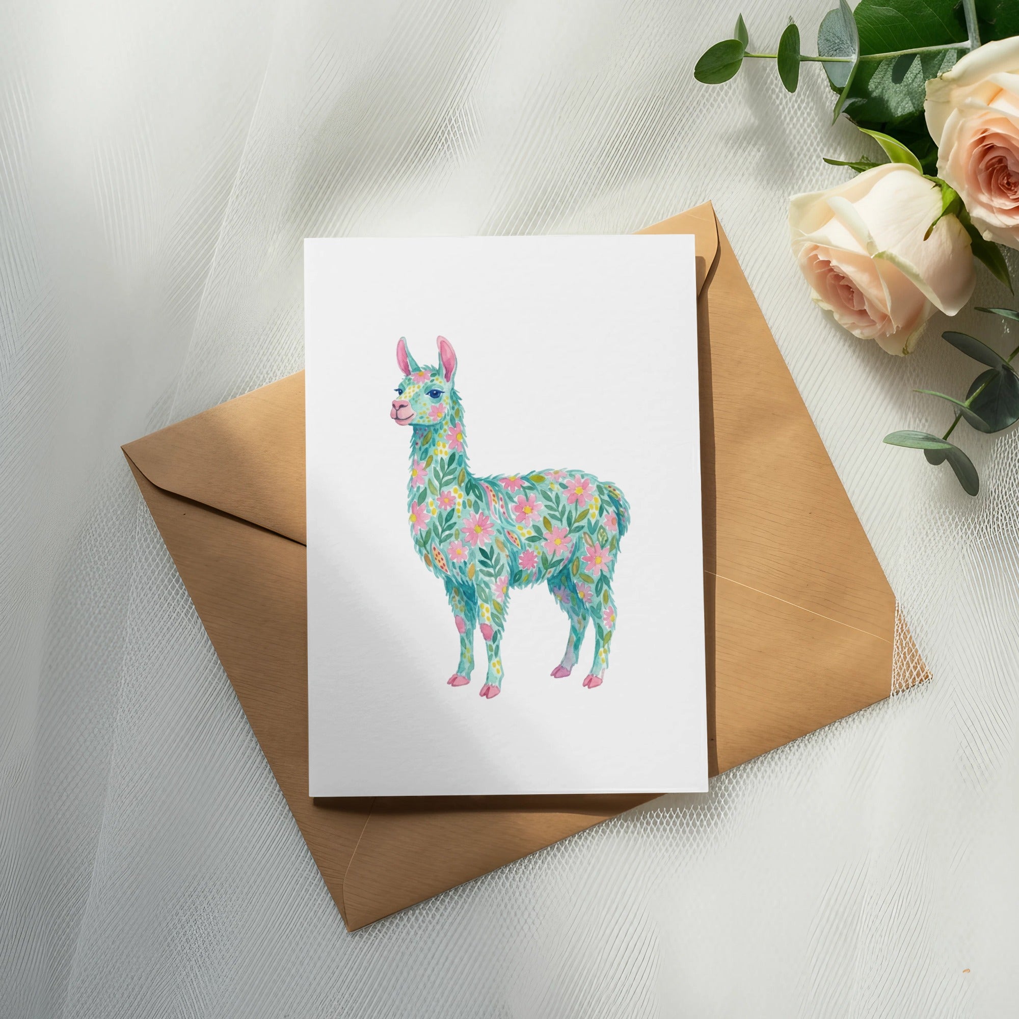 Watercolor llama with floral pattern on greeting card with envelope and roses.