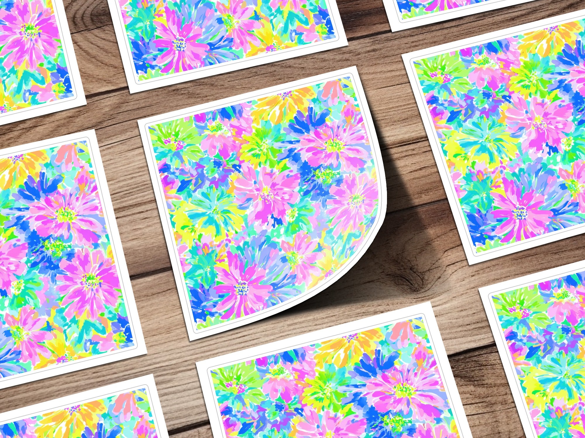 Pattern of colorful floral illustrations on white cards.