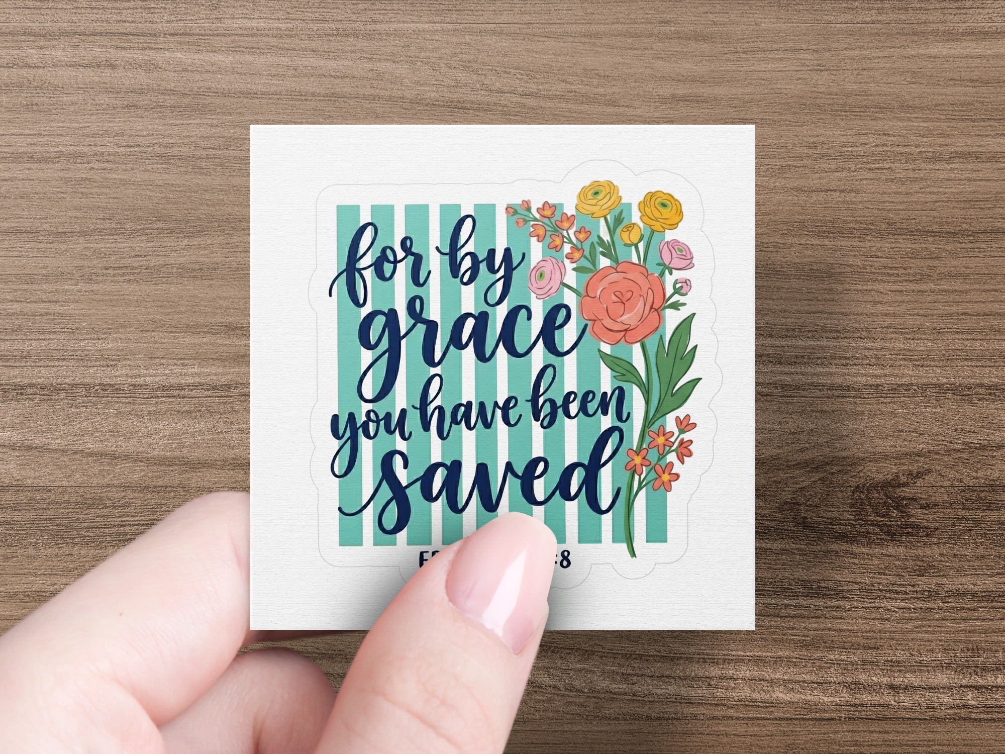 Sticker with "For by grace you have been saved" text and floral accents.