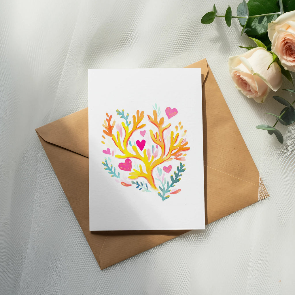 Card with colorful coral and heart design on brown envelope with roses.