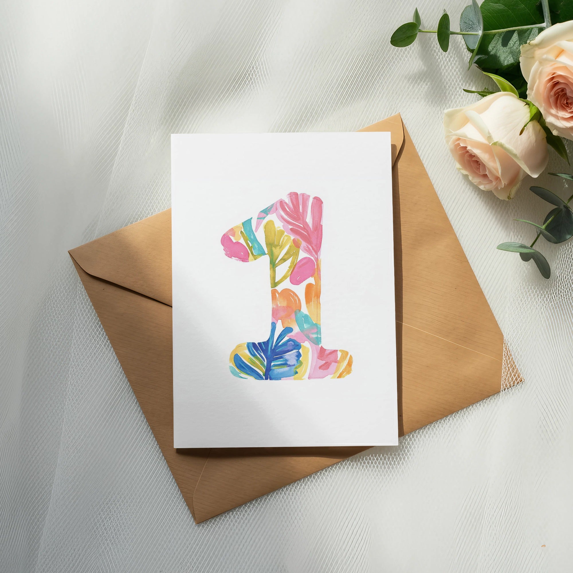 Card with colorful "1" design on brown envelope with roses.