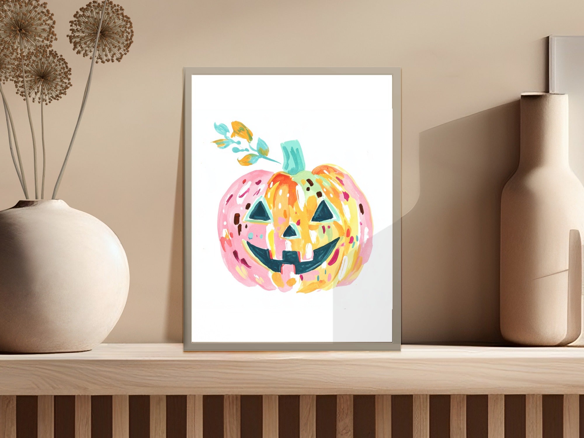 Watercolor illustration of a smiling, colorful pumpkin with a green stem.