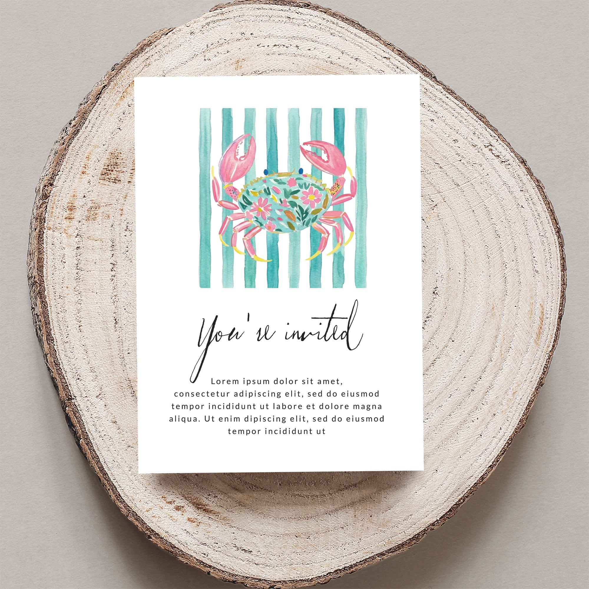 Invitation card with floral crab illustration and striped background.