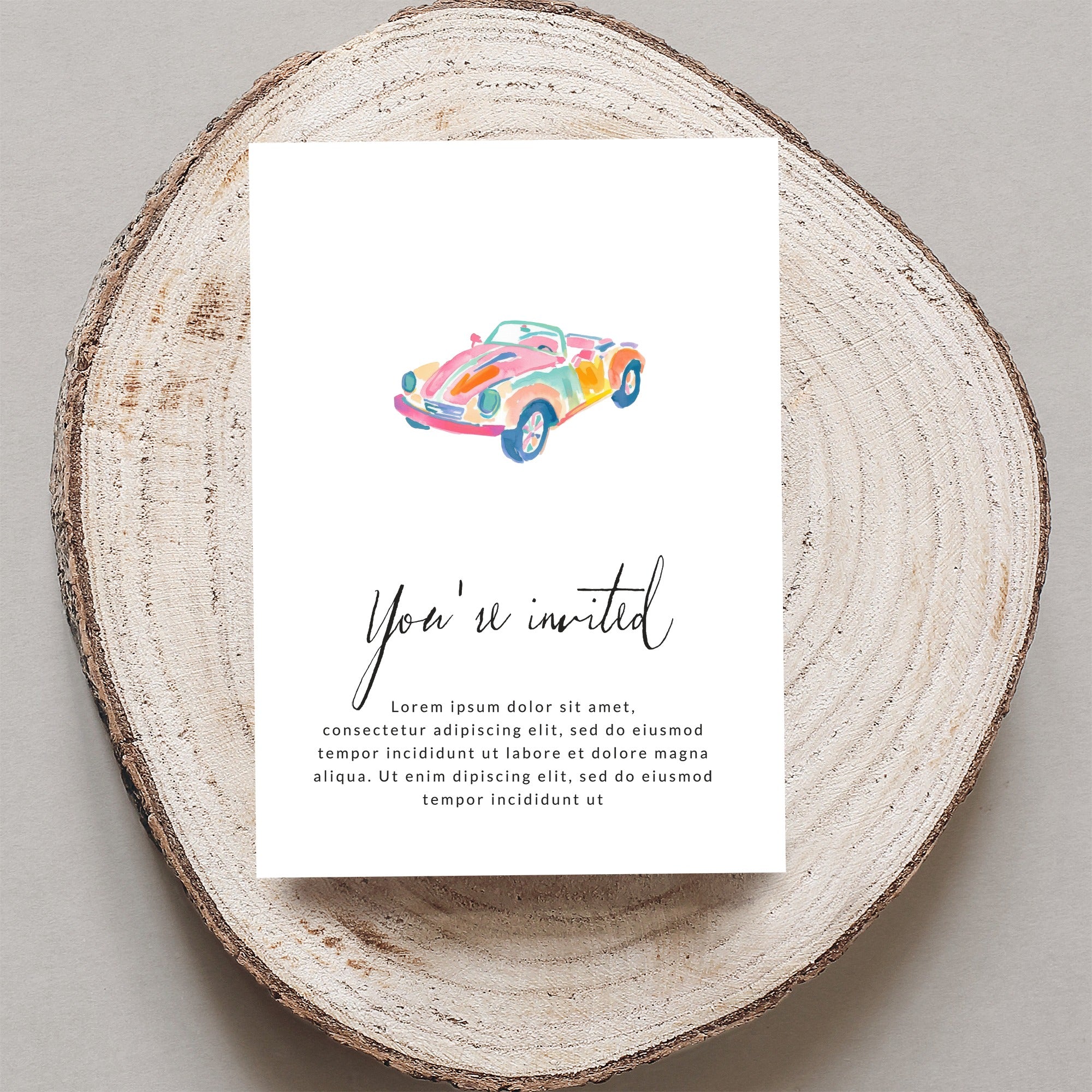 Invitation card with "You're invited" and watercolor convertible car.