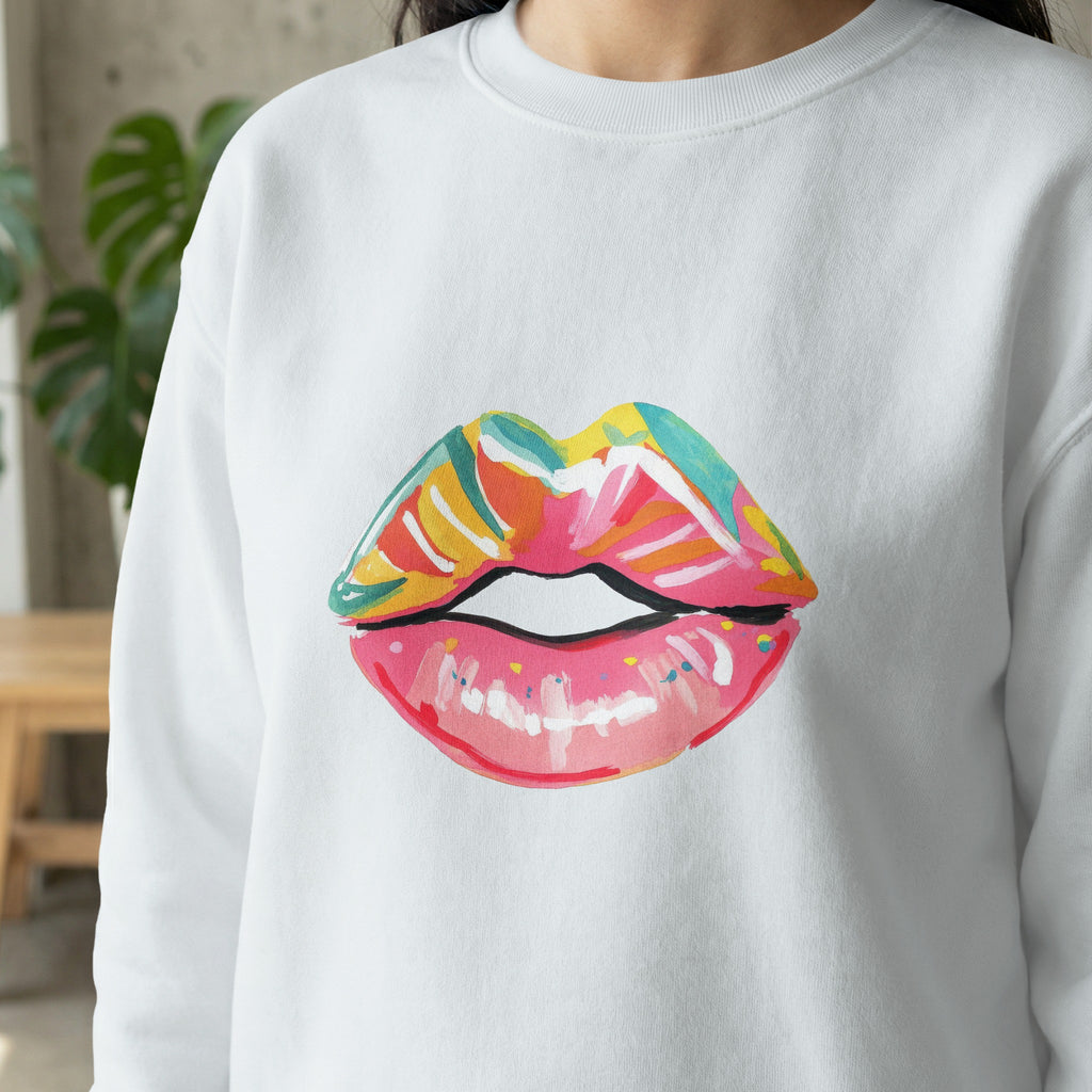 White sweatshirt with a colorful painted lips design.