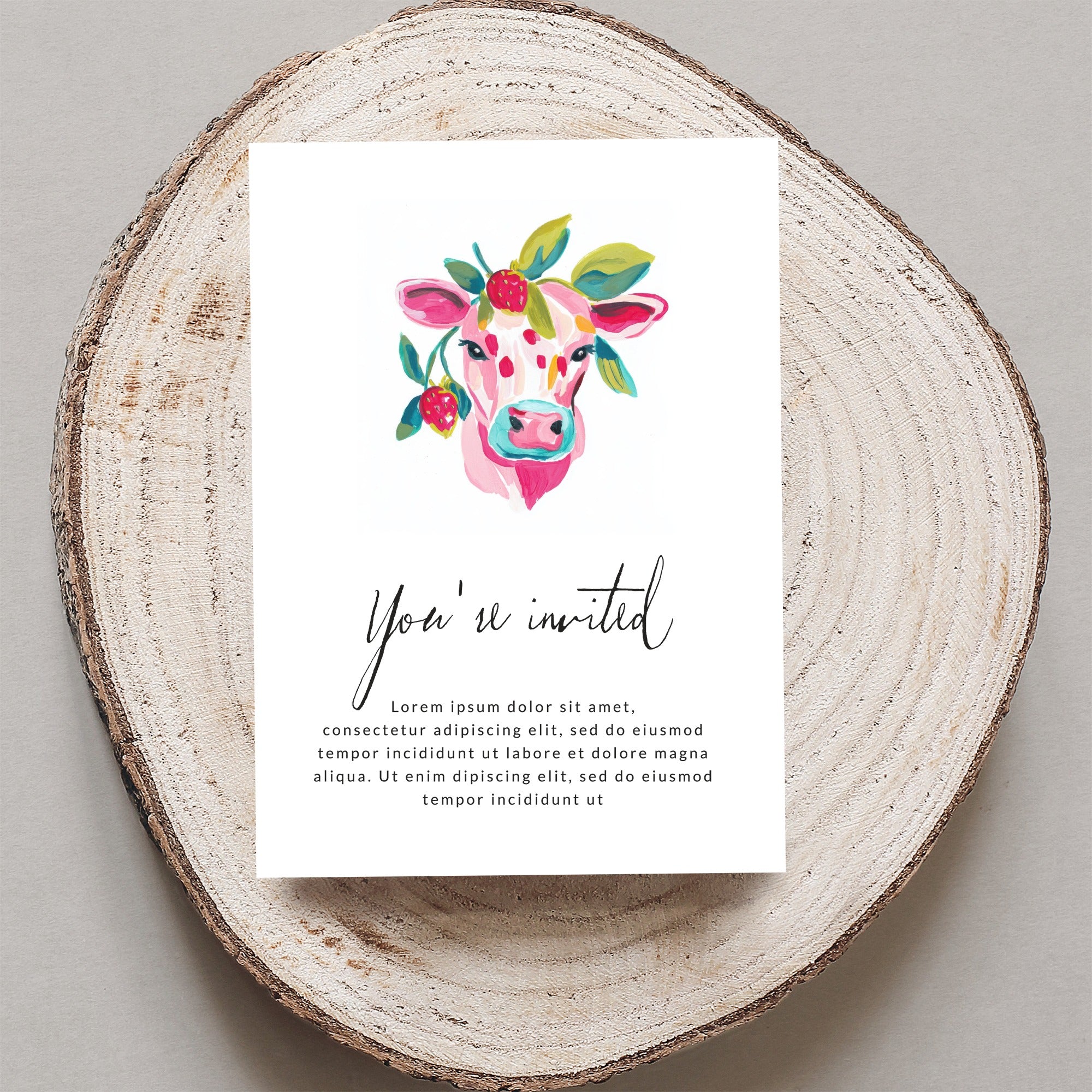 Cow with floral wreath invitation, "You're invited" text.