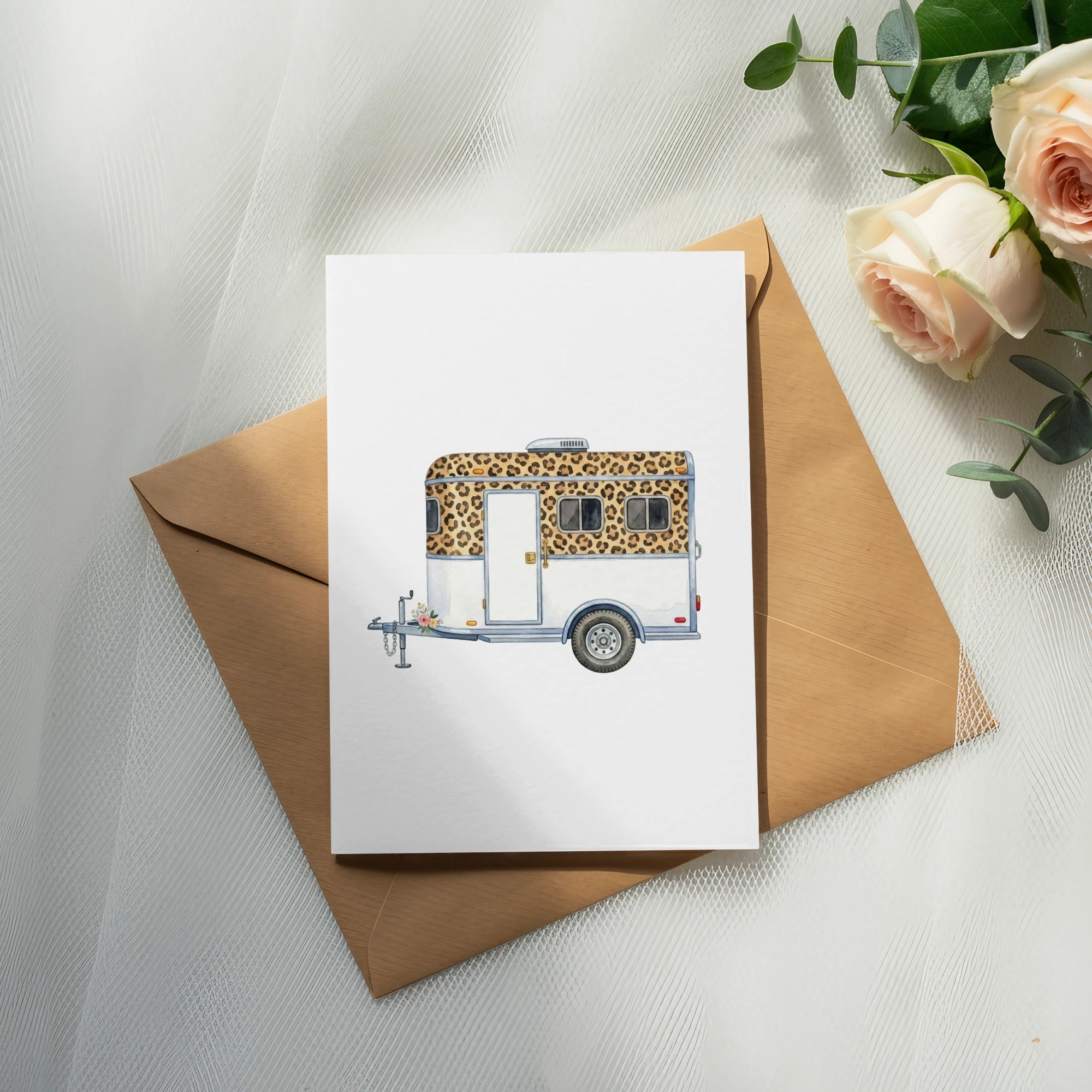 Card featuring a white teardrop camper with leopard print windows and flowers.