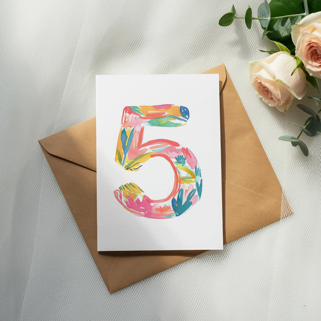 Card with a colorful number 5 design on a kraft envelope.