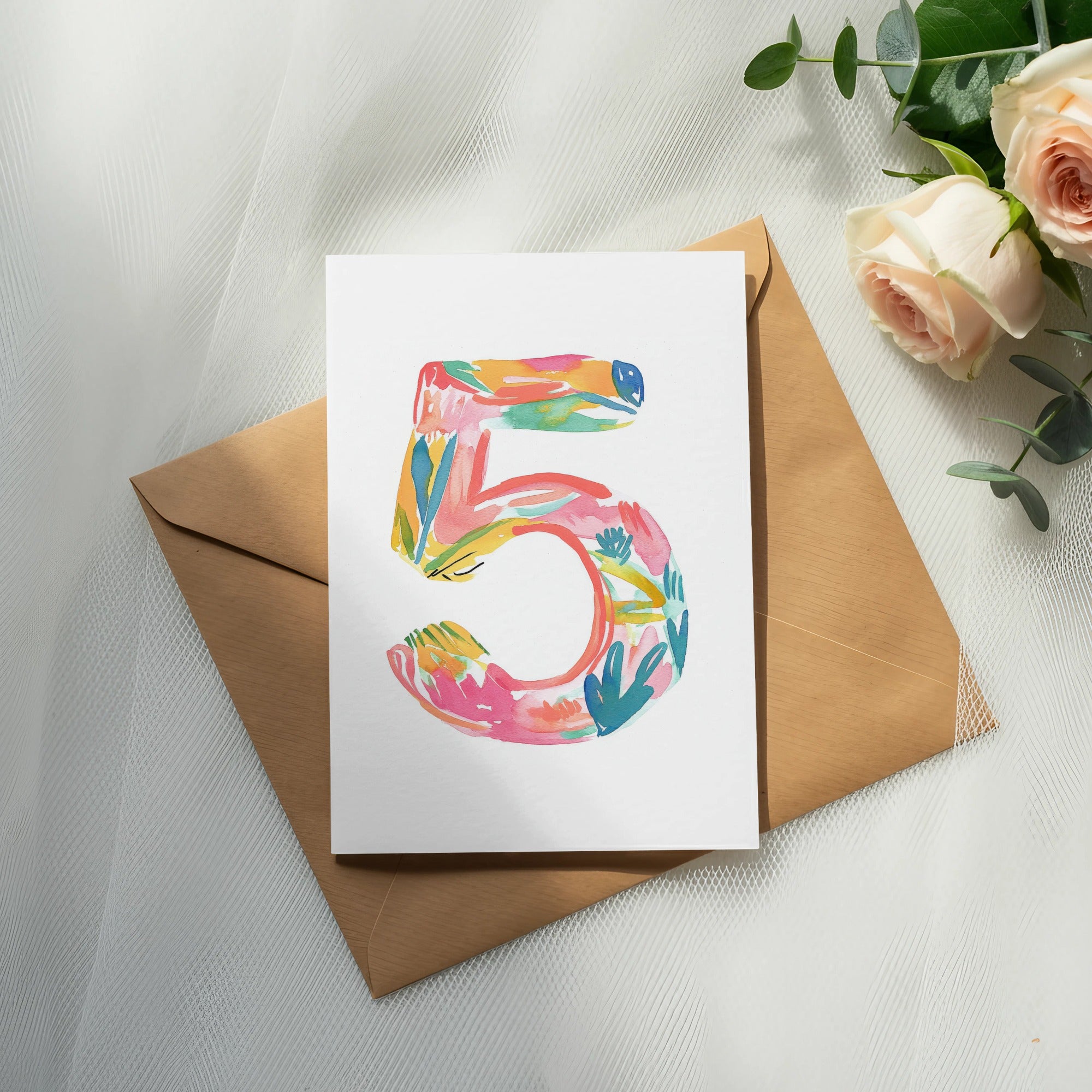 Card with a colorful number 5 design on a kraft envelope.