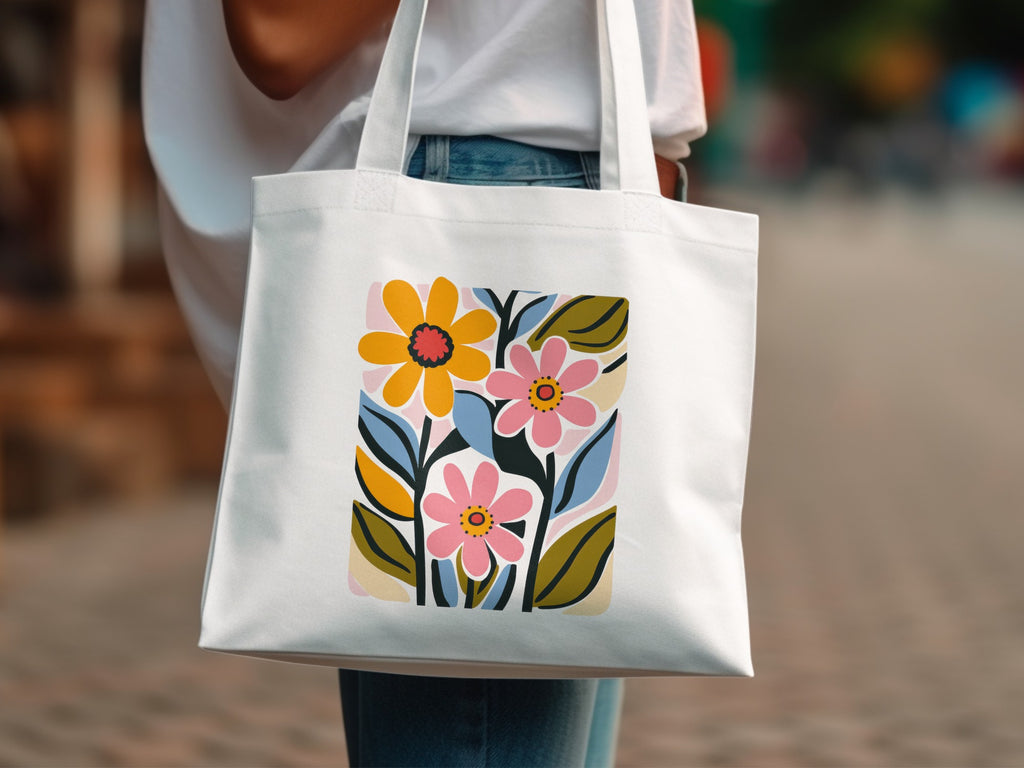 White tote bag with a colorful abstract floral design.