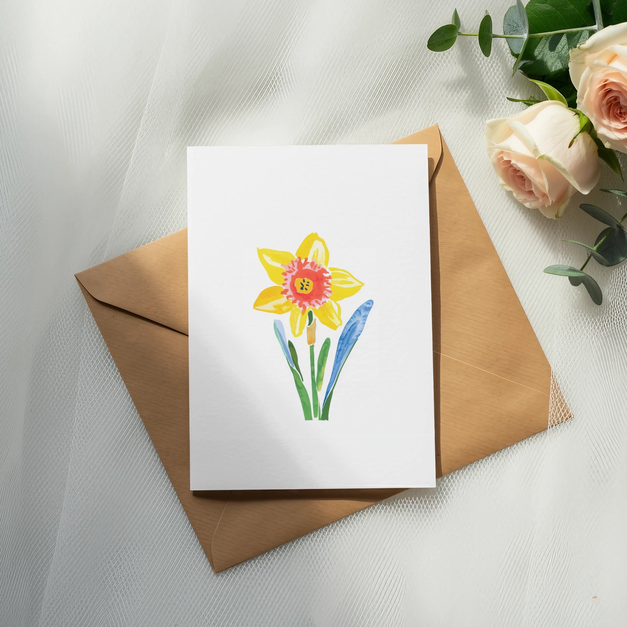 Watercolor daffodil illustration on a white card, atop a brown envelope.