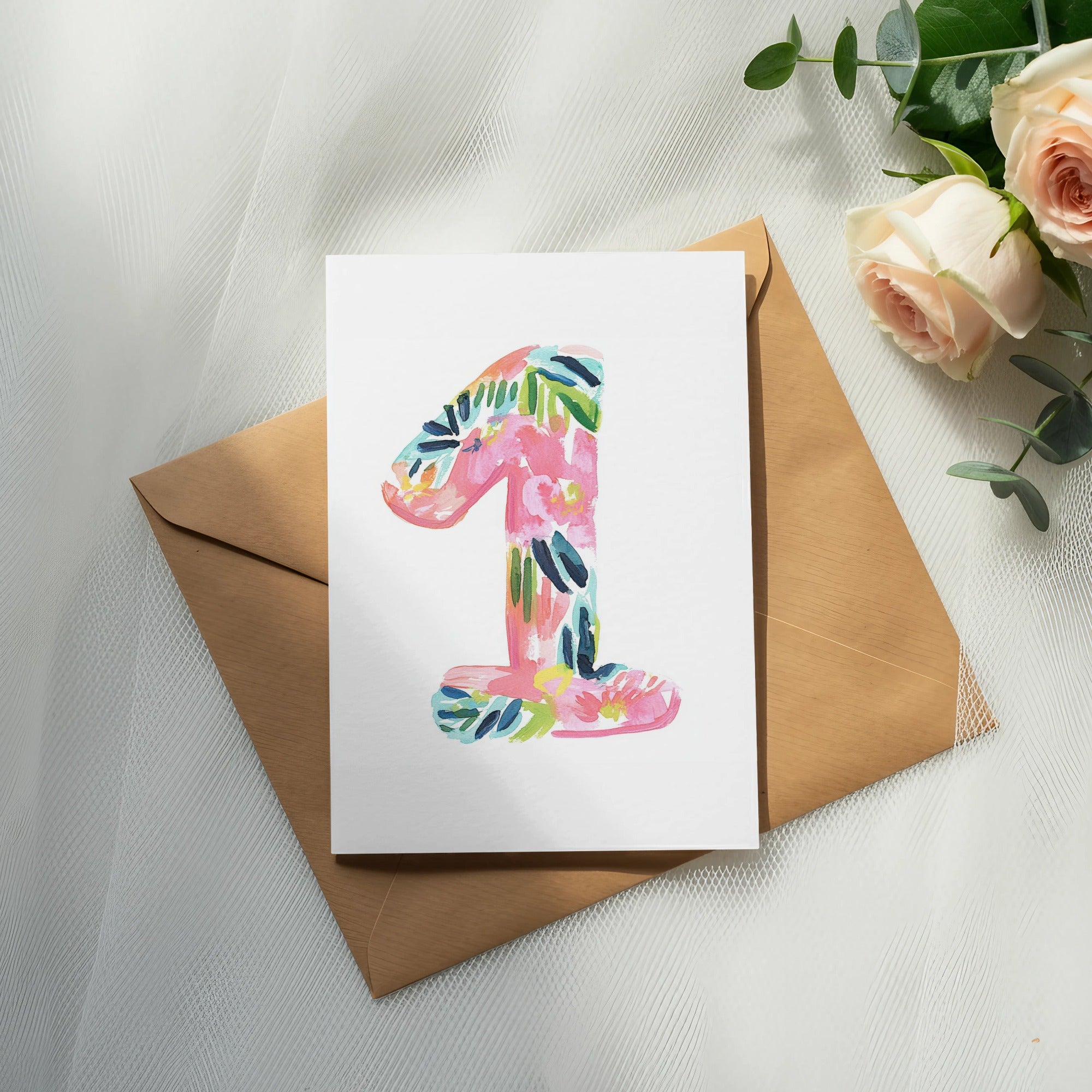 Card with floral painted number one on brown envelope with roses.