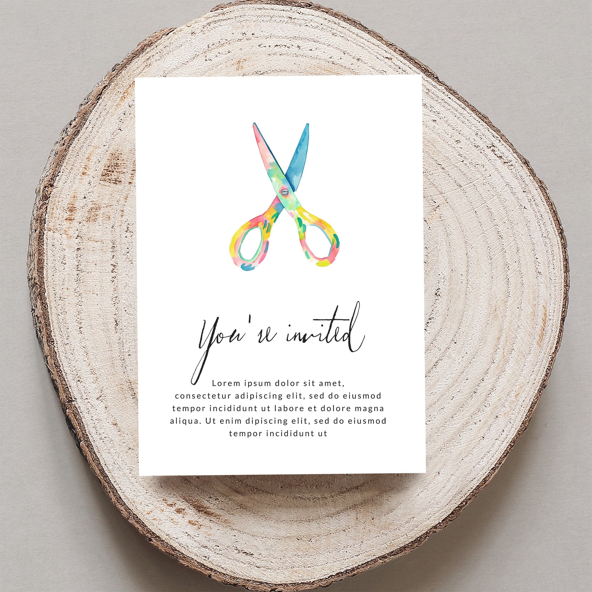 Invitation with scissors graphic and "You're invited" text.