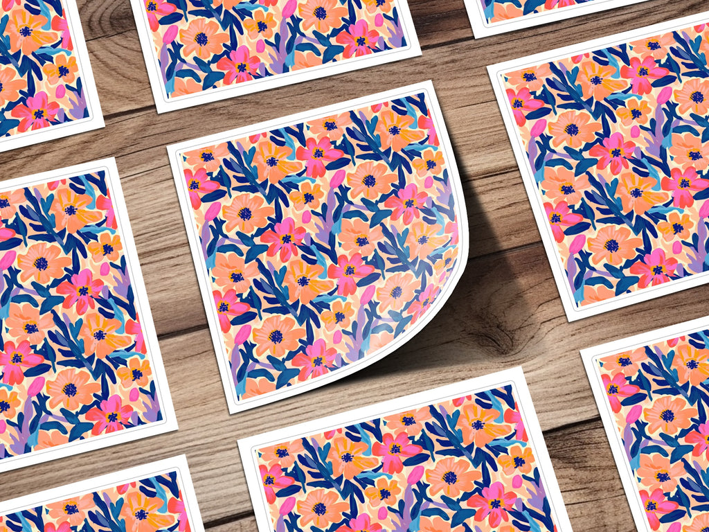 Floral pattern with pink, blue, and orange flowers on a wooden background.