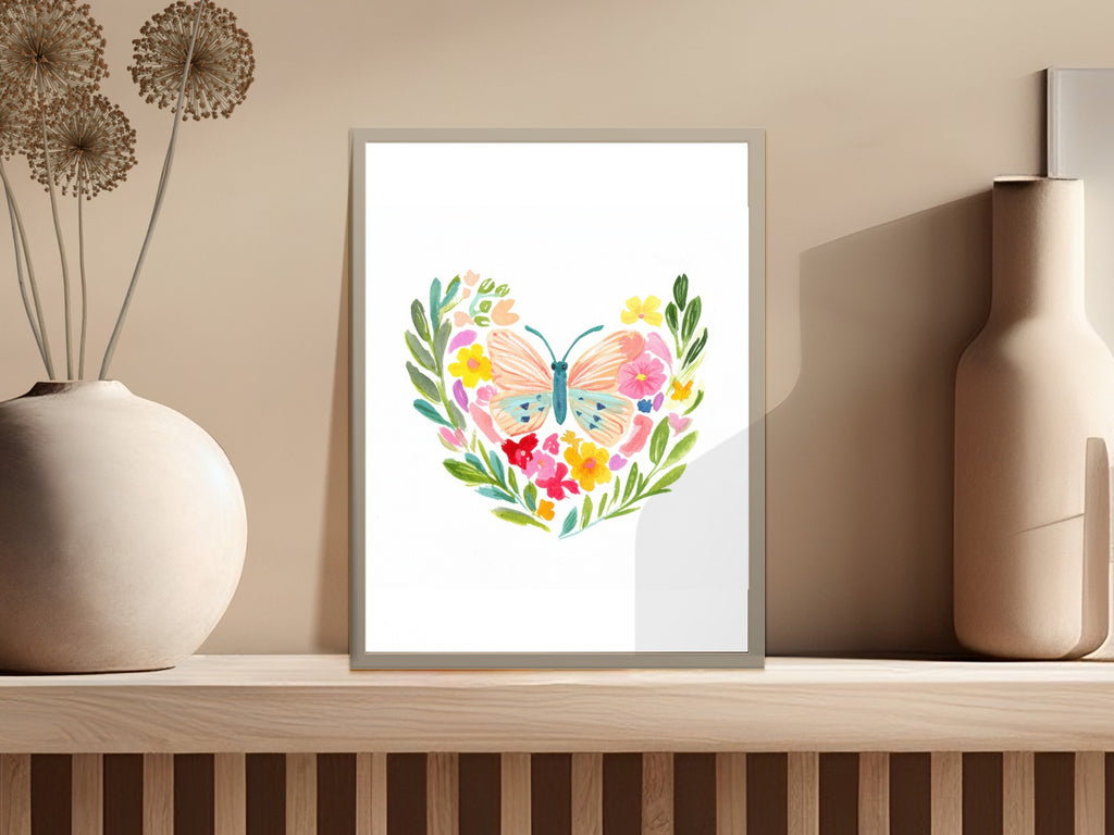 Watercolor butterfly with floral heart and pastel colors on white background.