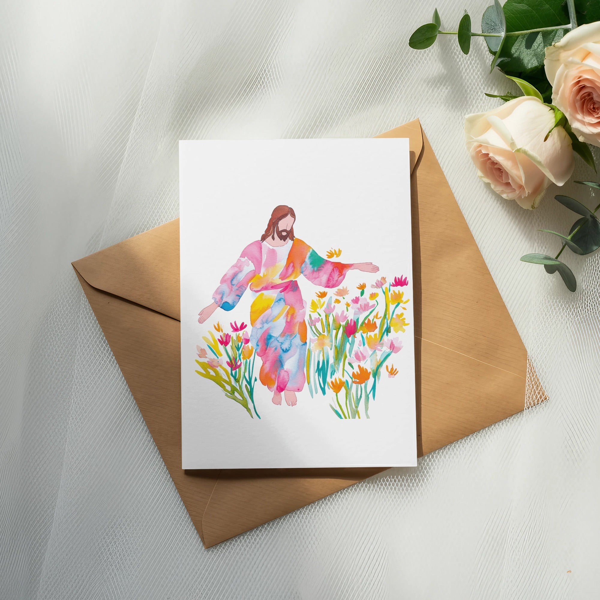 Watercolor painting of Jesus surrounded by colorful flowers on a brown envelope.