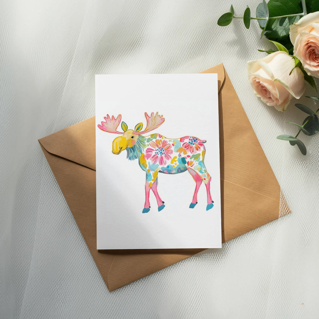 Card with colorful floral moose illustration on brown envelope.