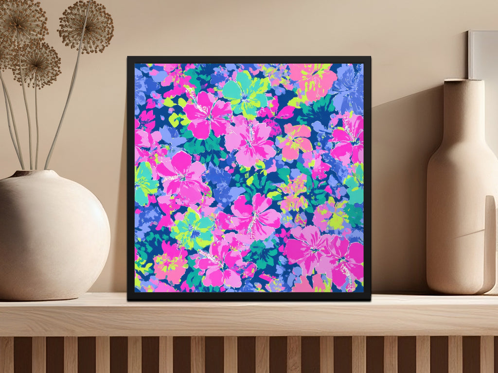 Square framed artwork with a vibrant pink and blue floral print.