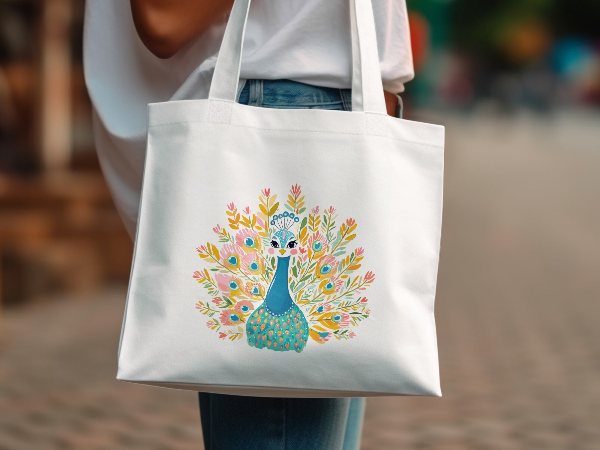 White tote bag with a colorful watercolor peacock illustration.