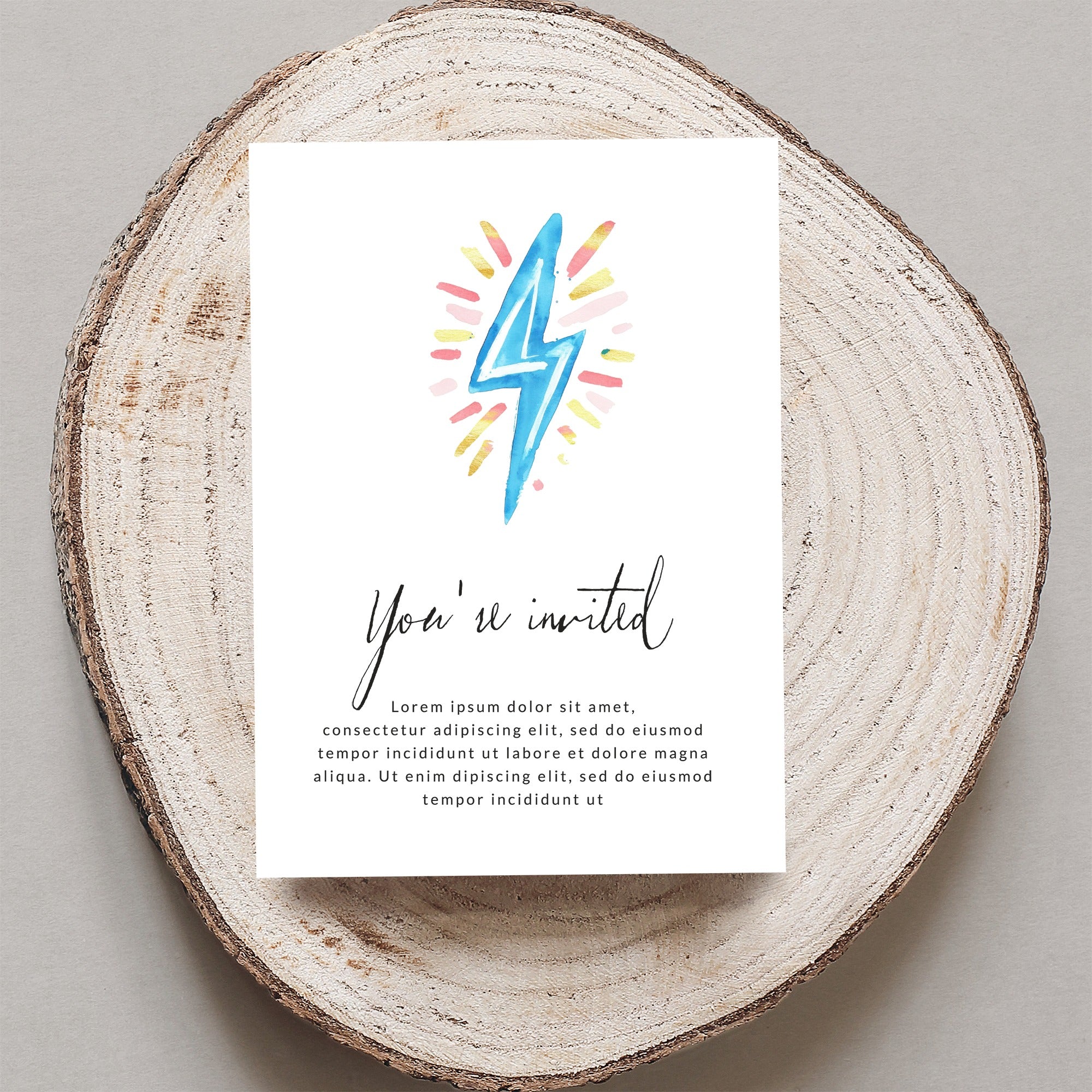 Invitation card with "You're invited" and watercolor lightning bolt.