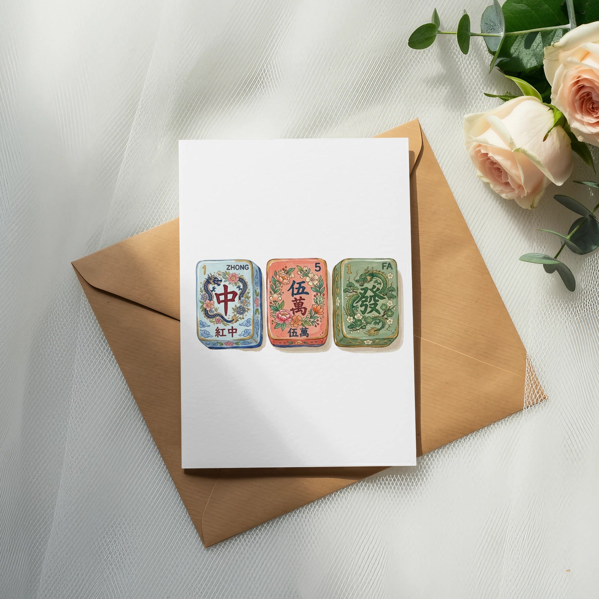 Mahjong tiles Zhong, Zhong, and Fa on a white card with a brown envelope.
