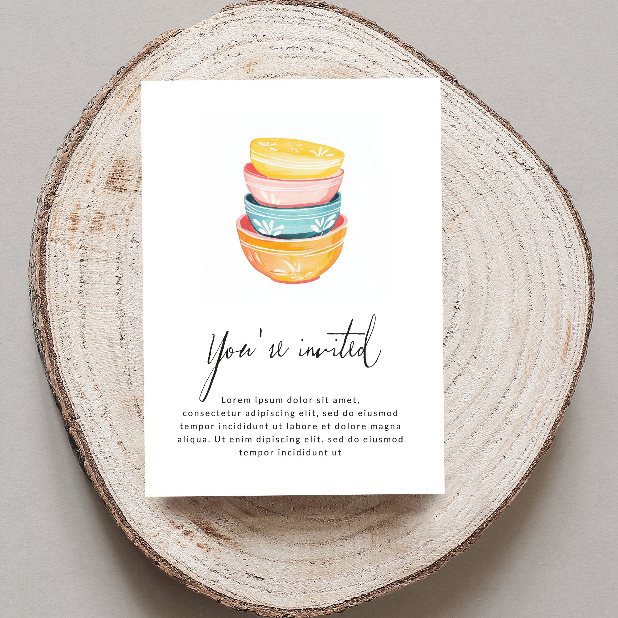Invitation card with "You're invited" and stacked colorful bowls.