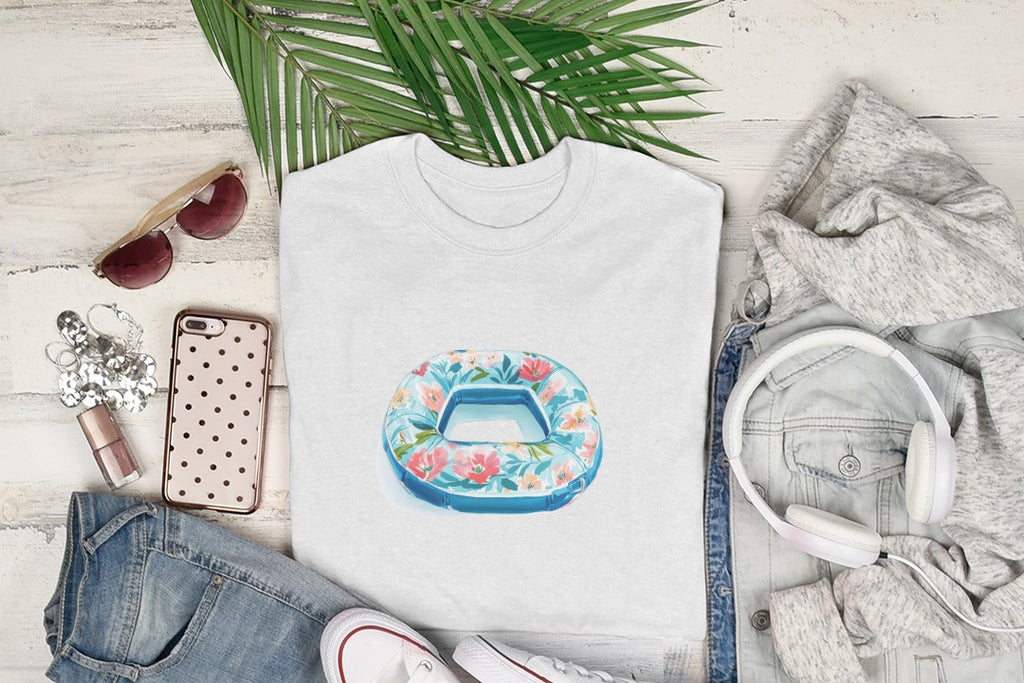 White t-shirt with a floral pool float graphic, surrounded by clothing and accessories.