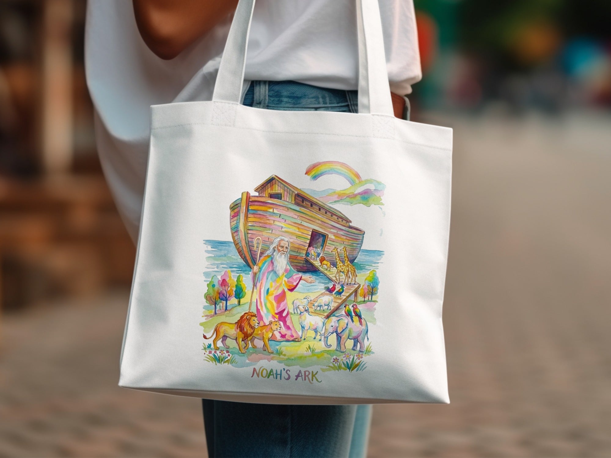 Noah's Ark illustration with animals and a rainbow, on a white tote bag.