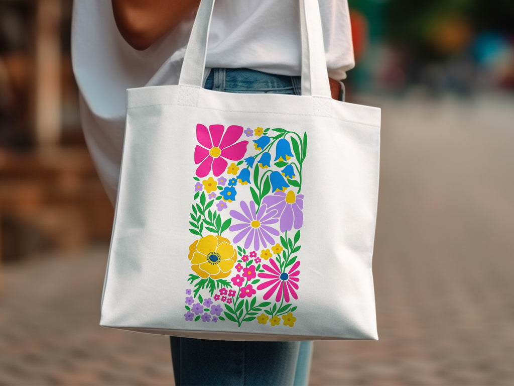 White tote bag with colorful floral bouquet design.