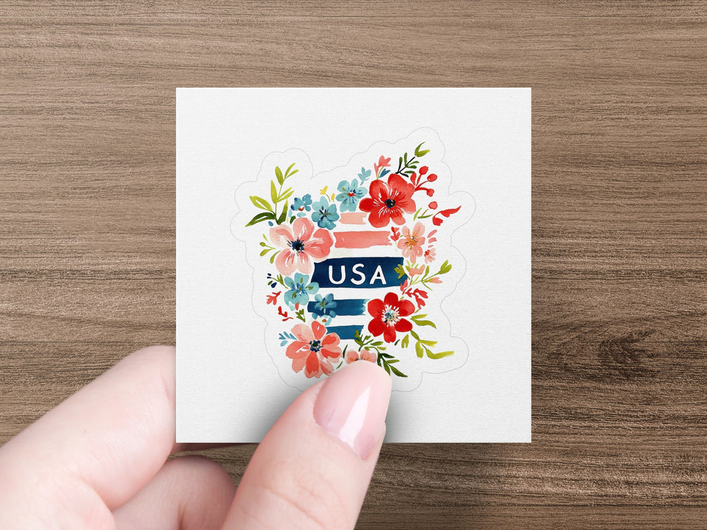 Floral USA sticker with red, white, and blue flowers on white background.