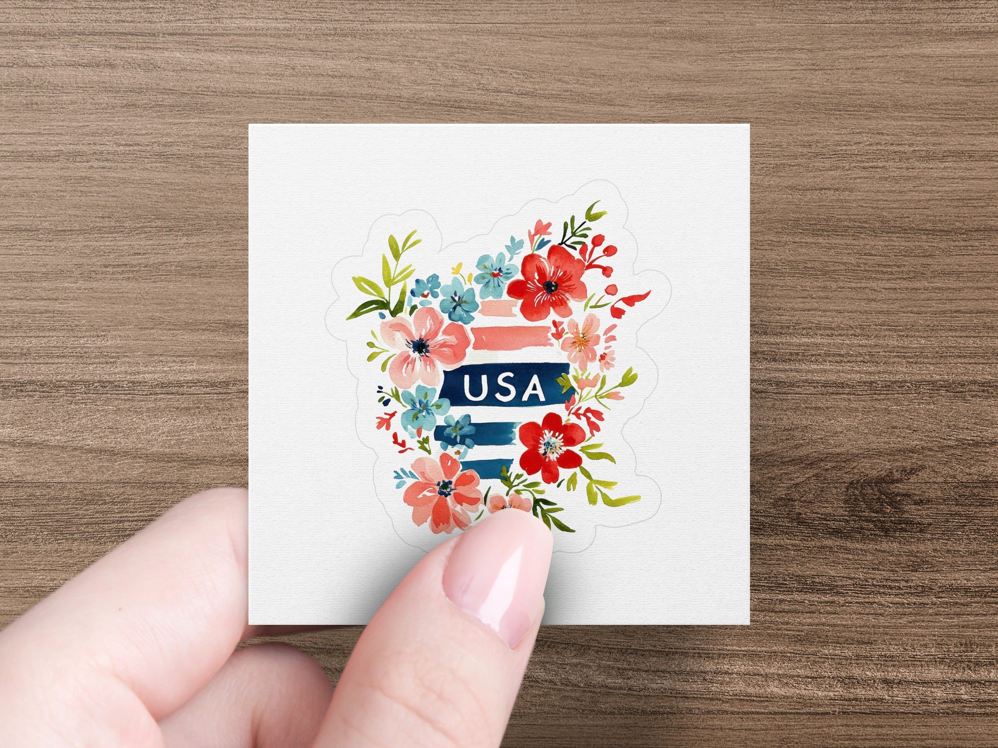 Floral USA sticker with red, white, and blue flowers on white background.