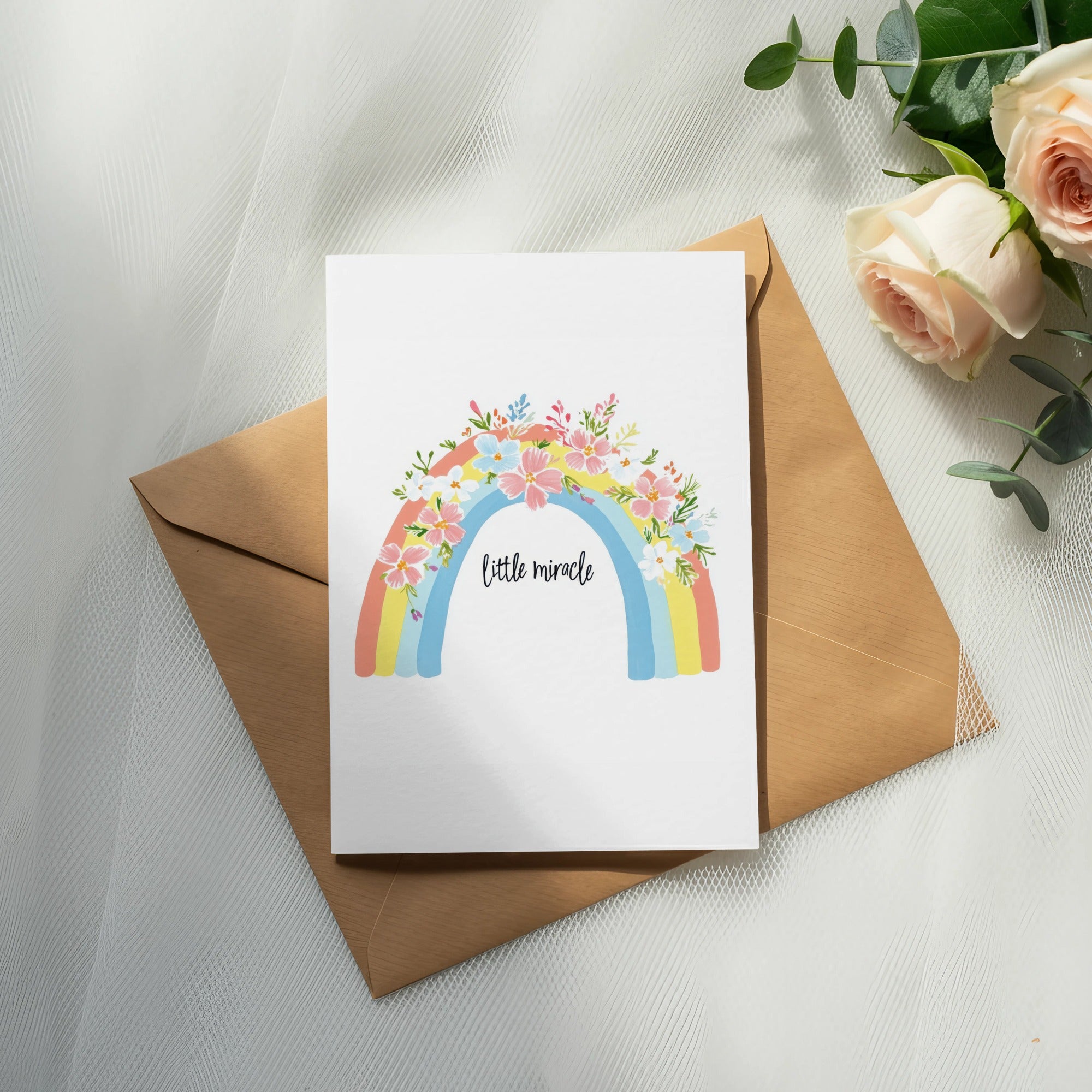 Greeting card with rainbow and floral design, says "little miracle."