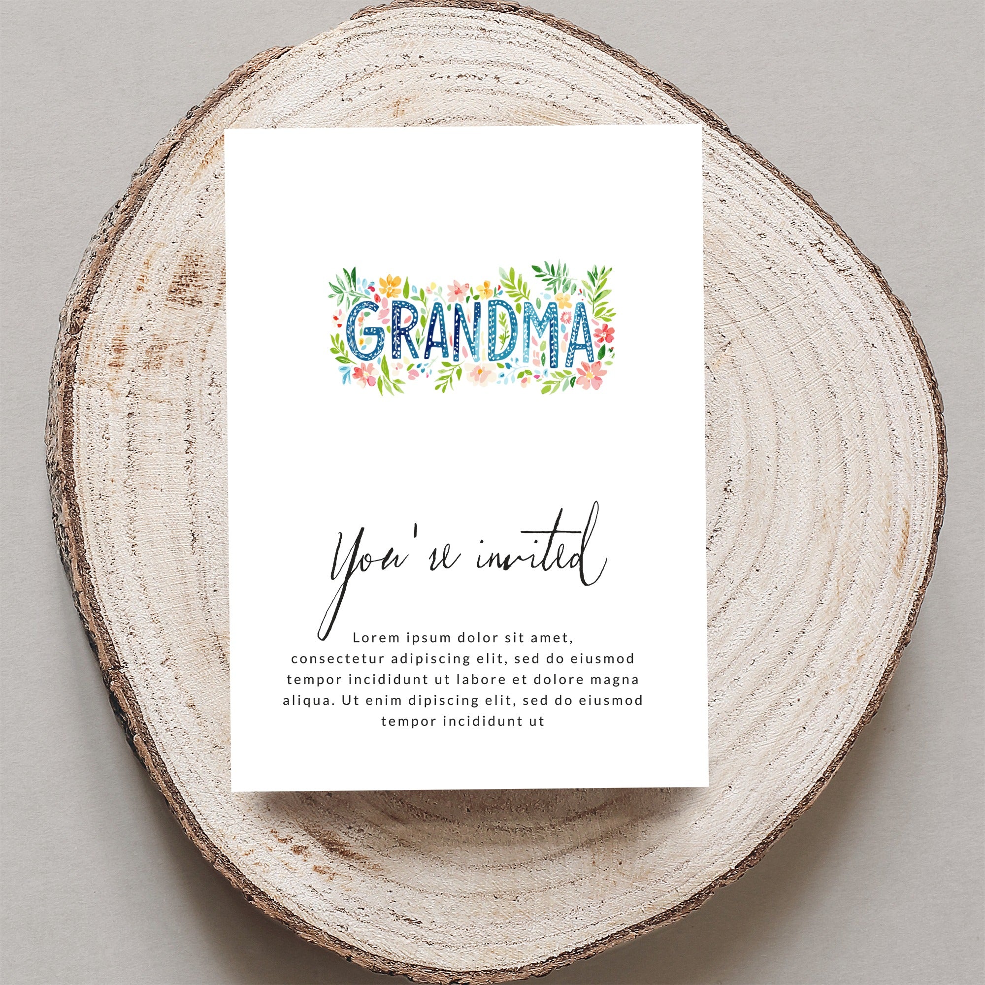 "GRANDMA" floral invitation with "You're invited" text.