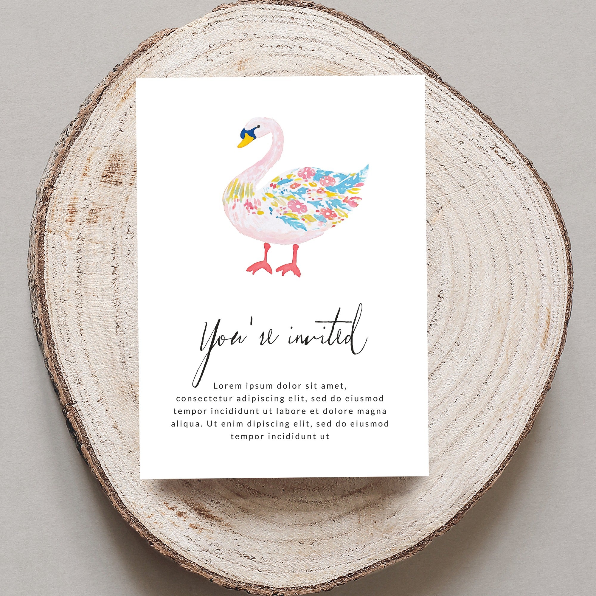 Illustrated swan on a "You're invited" invitation with placeholder text.
