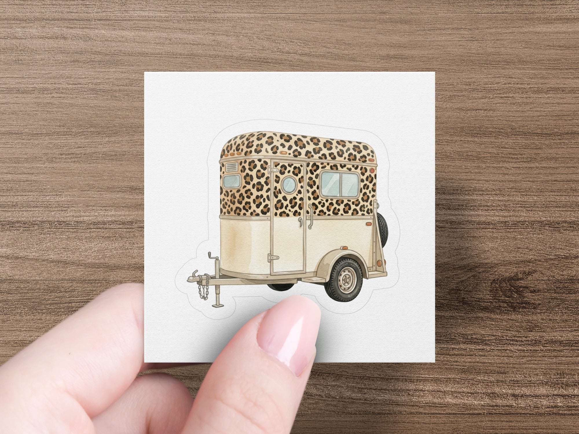 A horse trailer with a leopard print design and tan accents.