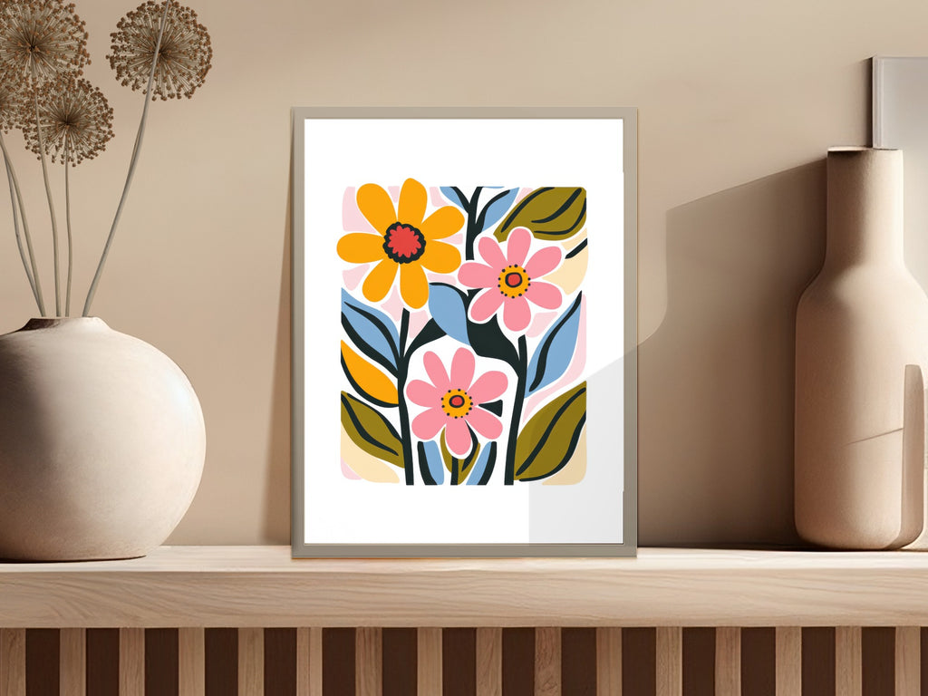 Abstract colorful floral art print in a light gray frame on a shelf.