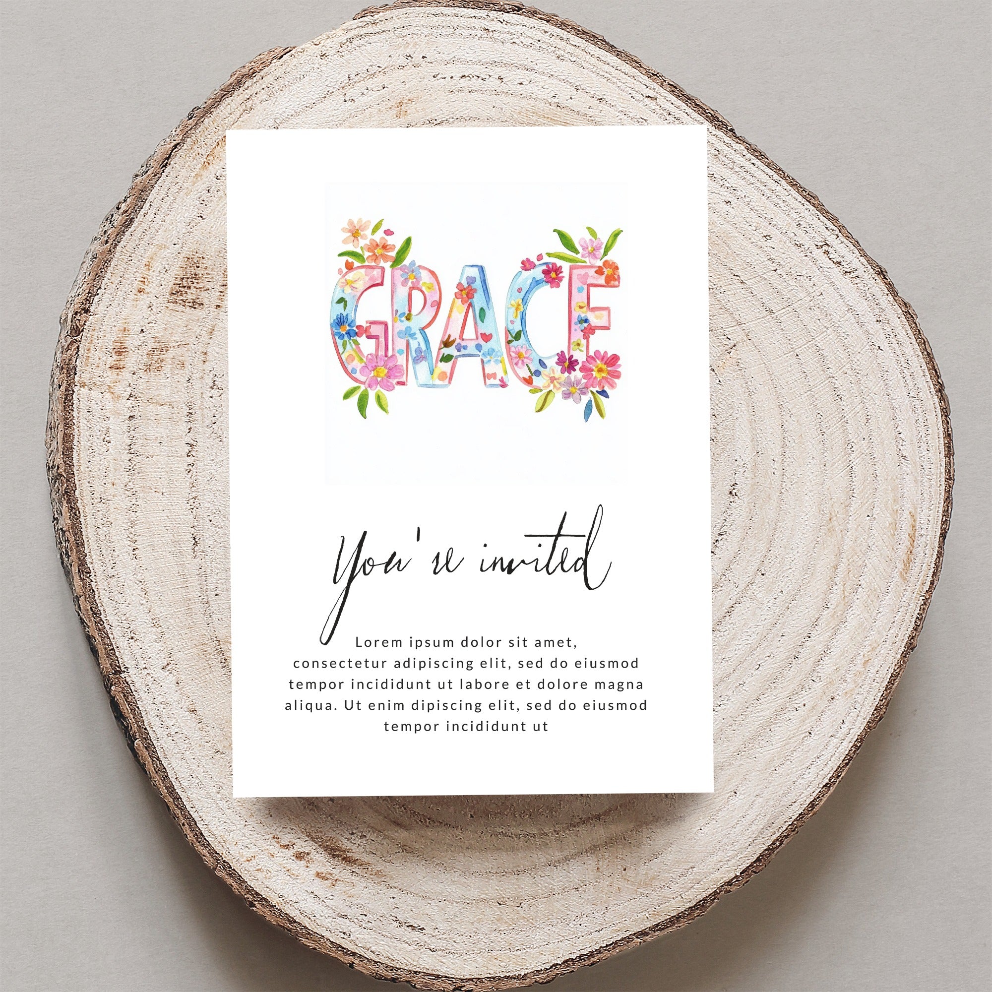 "GRACE" invitation with floral letters and placeholder text.