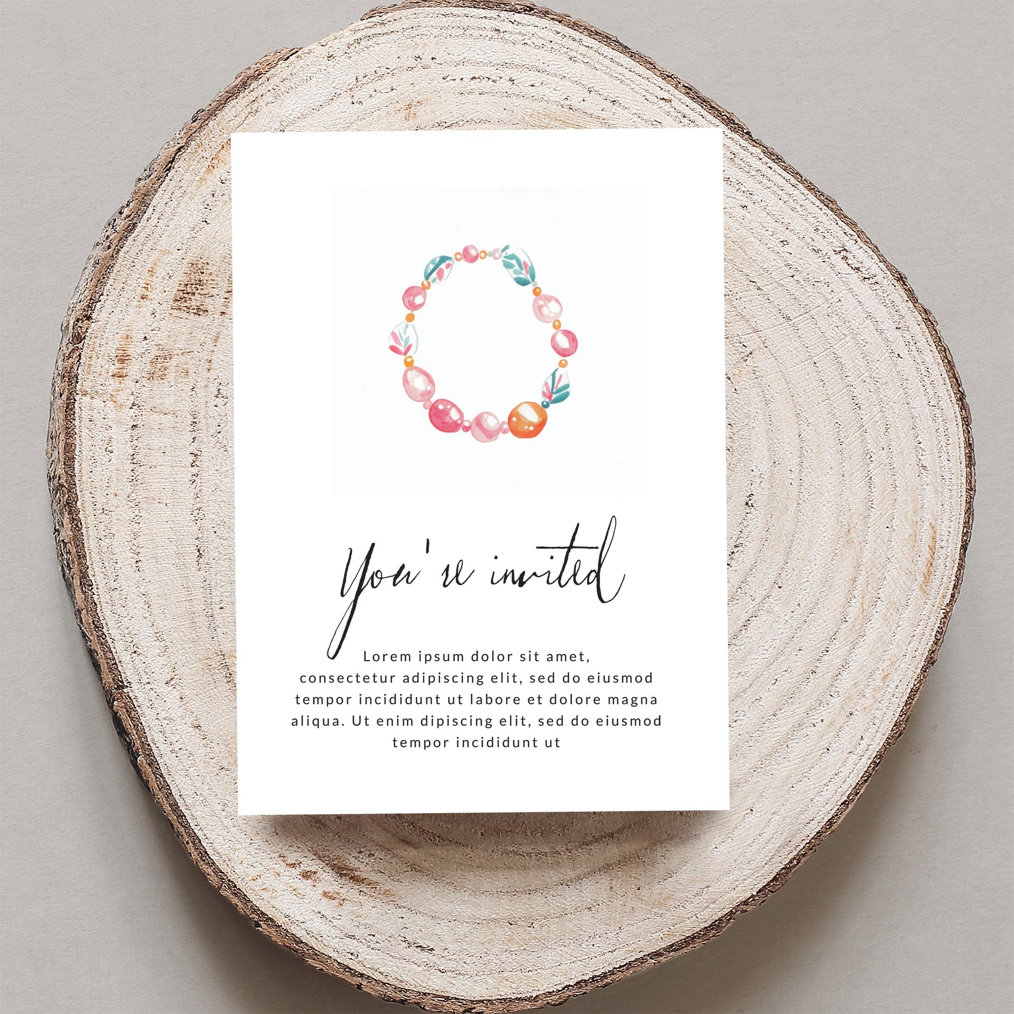 Invitation with floral wreath design and placeholder text.