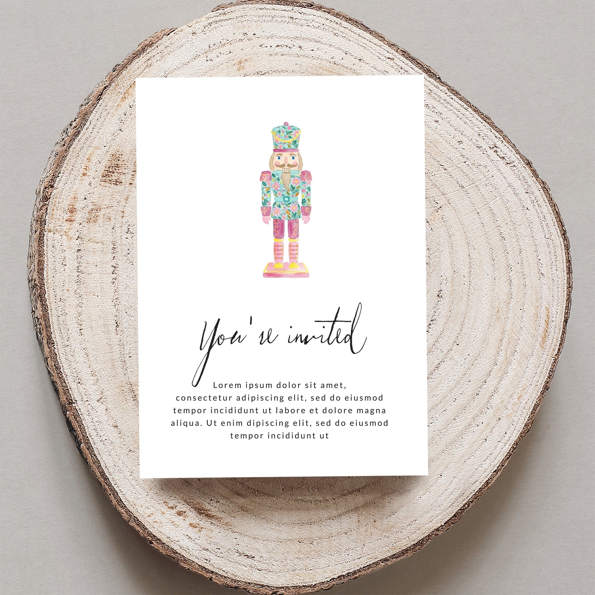 Invitation with watercolor nutcracker illustration and placeholder text.