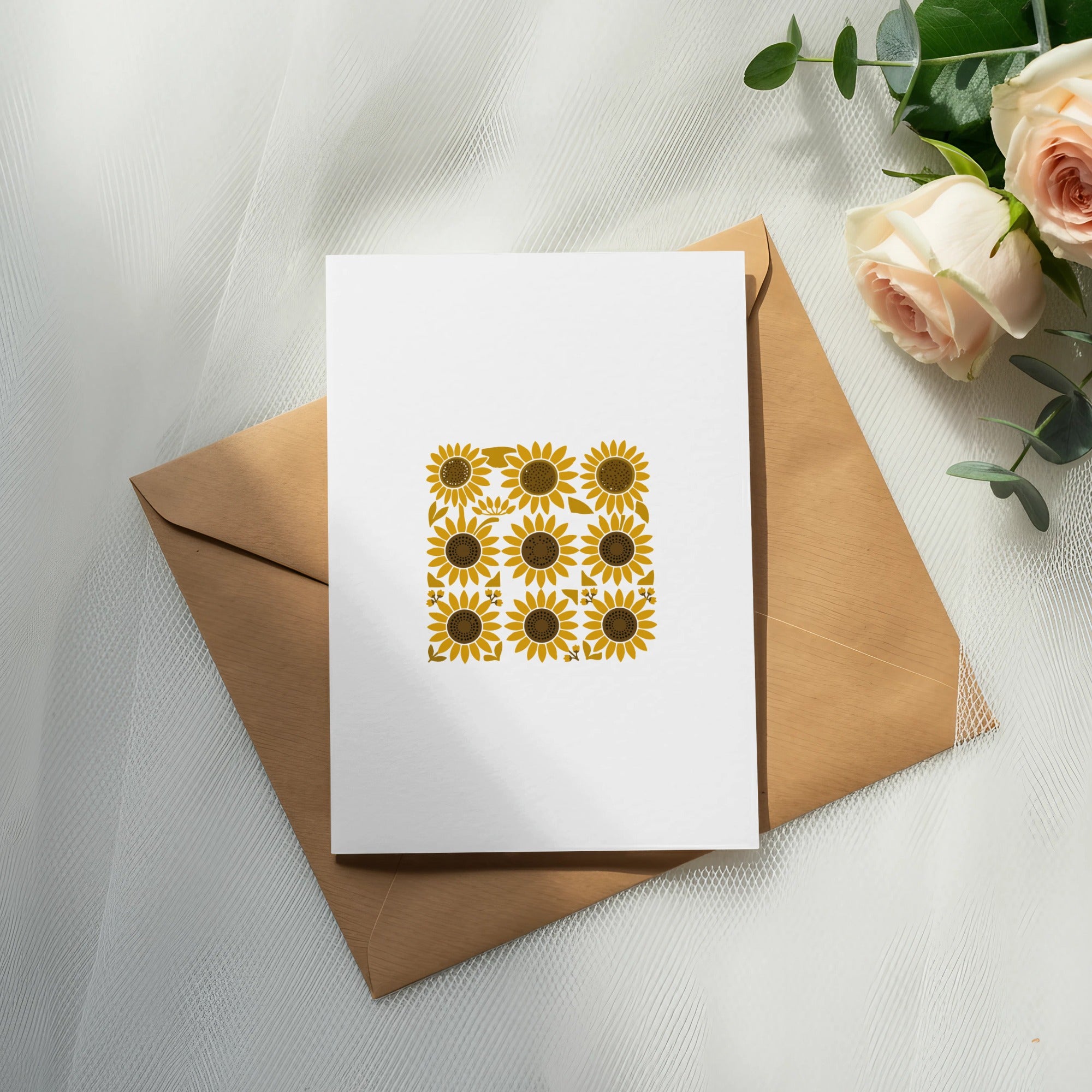 Card with sunflower pattern on envelope, with roses and eucalyptus.