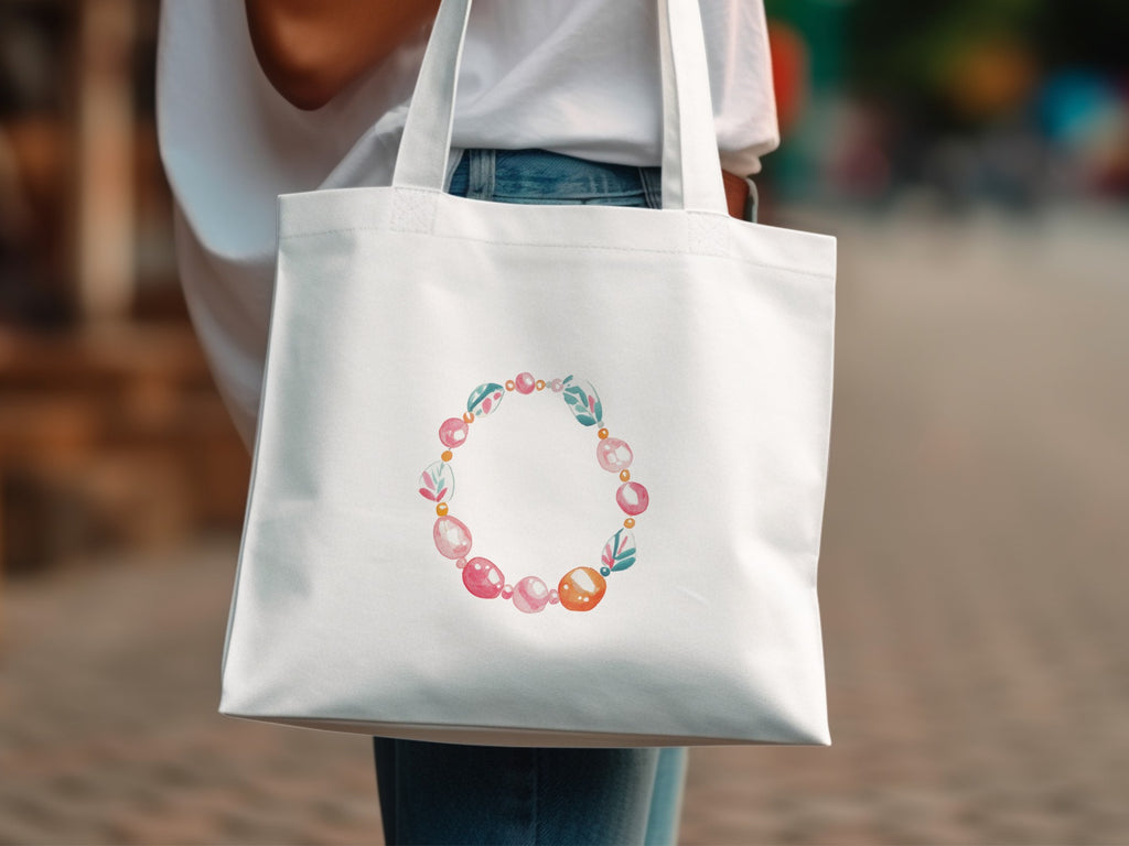 White canvas tote bag with circular beaded floral design.